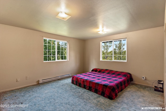 2261 Ridgewood Dr, Wasilla, AK 99654 - carpeted bedroom featuring baseboard heating and baseboards