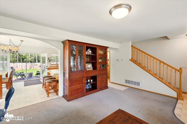 500 S Daysha Cir, Palmer, AK 99645 - living area featuring stairs, a chandelier, carpet floors, and arched walkways