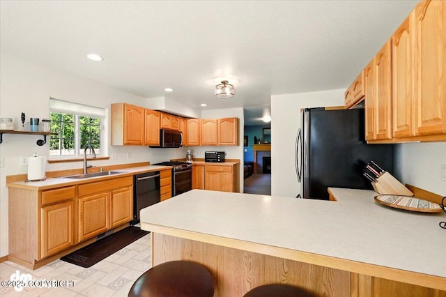 500 S Daysha Cir, Palmer, AK 99645 - kitchen with black appliances, a sink, a peninsula, light countertops, and recessed lighting