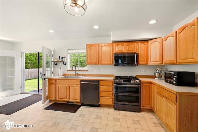 500 S Daysha Cir, Palmer, AK 99645 - kitchen featuring dishwasher, double oven range, a sink, light countertops, and recessed lighting