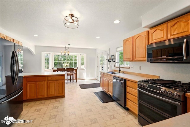 500 S Daysha Cir, Palmer, AK 99645 - kitchen featuring stainless steel appliances, a sink, arched walkways, light countertops, and light flooring