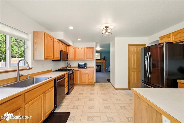 500 S Daysha Cir, Palmer, AK 99645 - kitchen featuring freestanding refrigerator, a sink, black dishwasher, range with gas stovetop, and light flooring