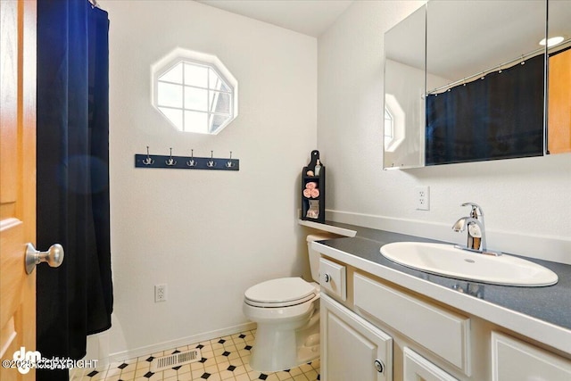 500 S Daysha Cir, Palmer, AK 99645 - bathroom featuring vanity, toilet, tile patterned floors, and baseboards