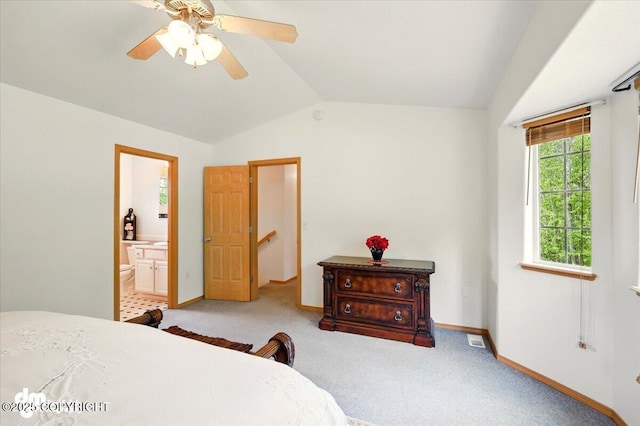 500 S Daysha Cir, Palmer, AK 99645 - bedroom with vaulted ceiling, baseboards, light carpet, connected bathroom, and ceiling fan