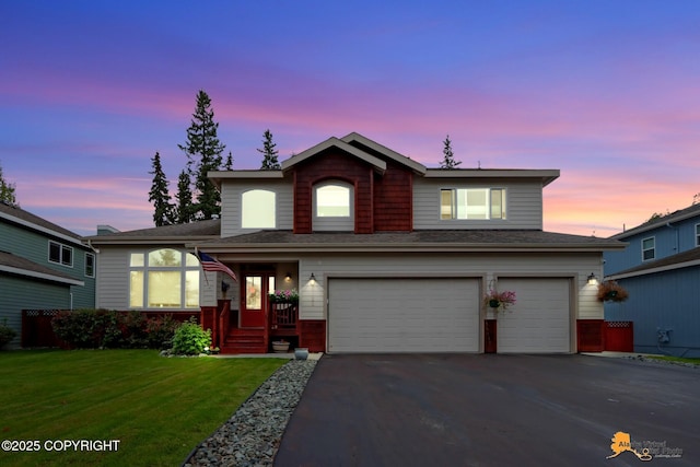 8725 Colusa Cir, Eagle River, AK 99577 - traditional-style house with a garage, asphalt driveway, and a yard