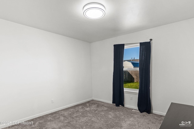 1404 Hedley Dr, Kenai, AK 99611 - spare room featuring carpet and baseboards