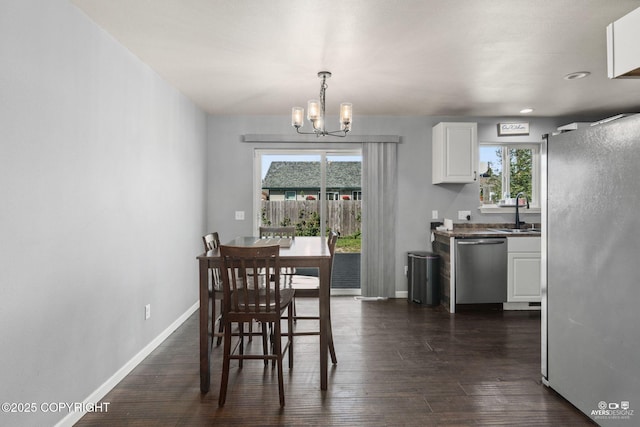 1404 Hedley Dr, Kenai, AK 99611 - dining space featuring a chandelier, plenty of natural light, baseboards, and recessed lighting