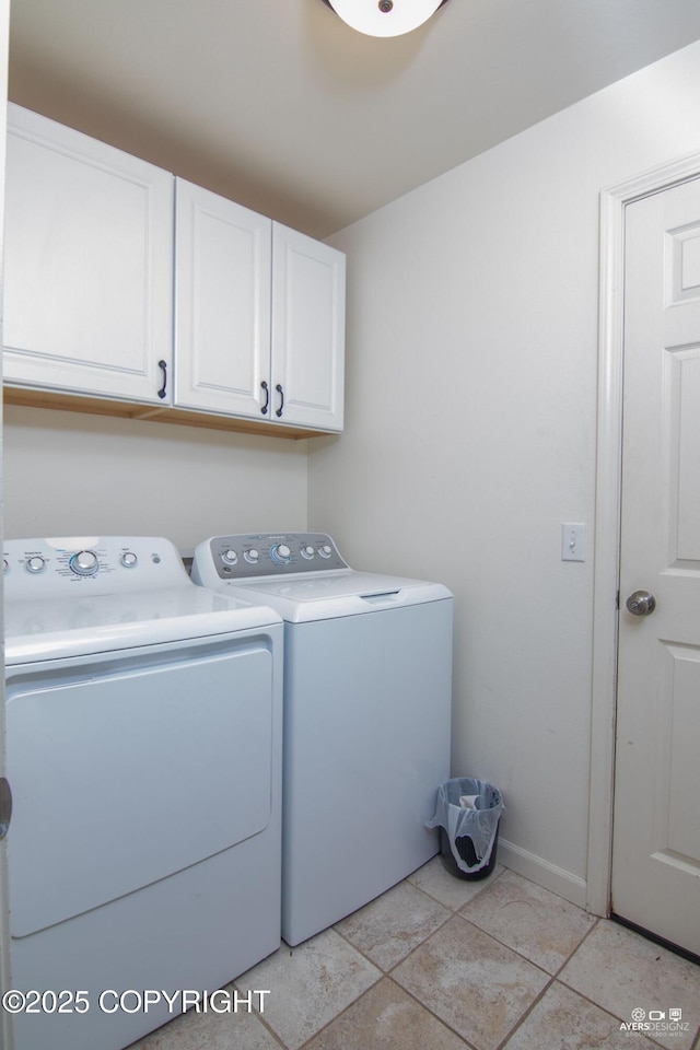 1404 Hedley Dr, Kenai, AK 99611 - laundry area with cabinet space, washer and dryer, and baseboards