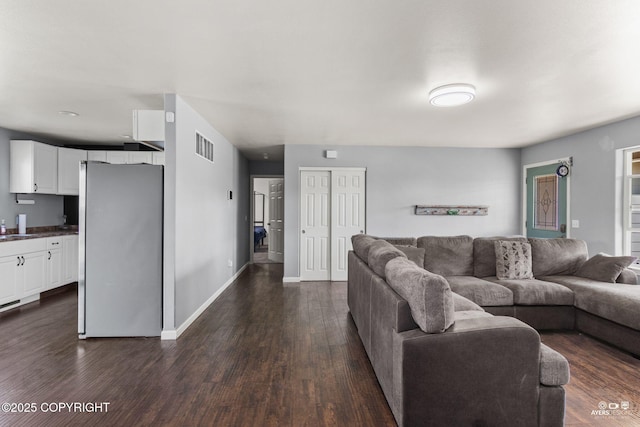 1404 Hedley Dr, Kenai, AK 99611 - living room featuring dark wood finished floors and baseboards