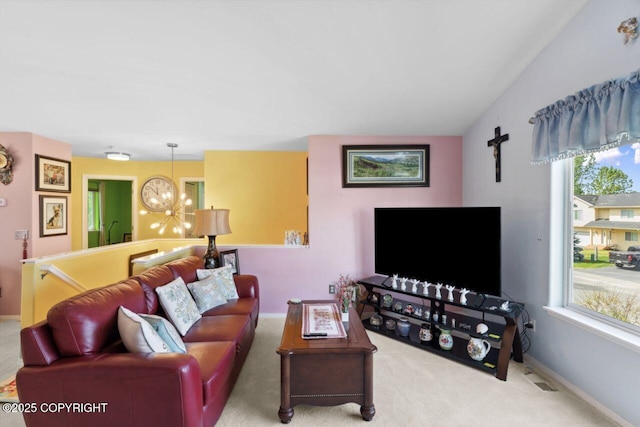 4245 Scenic View Dr, Anchorage, AK 99504 - carpeted living room with plenty of natural light, baseboards, and a chandelier