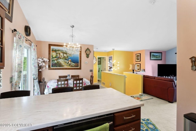 4245 Scenic View Dr, Anchorage, AK 99504 - kitchen with a chandelier, open floor plan, carpet flooring, light countertops, and hanging light fixtures