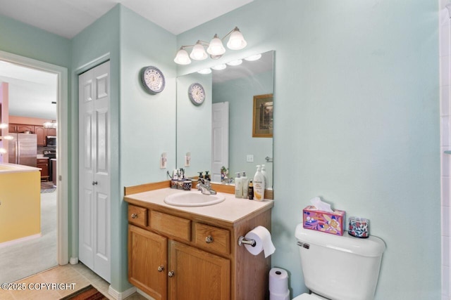 4245 Scenic View Dr, Anchorage, AK 99504 - full bathroom with vanity, toilet, and tile patterned flooring