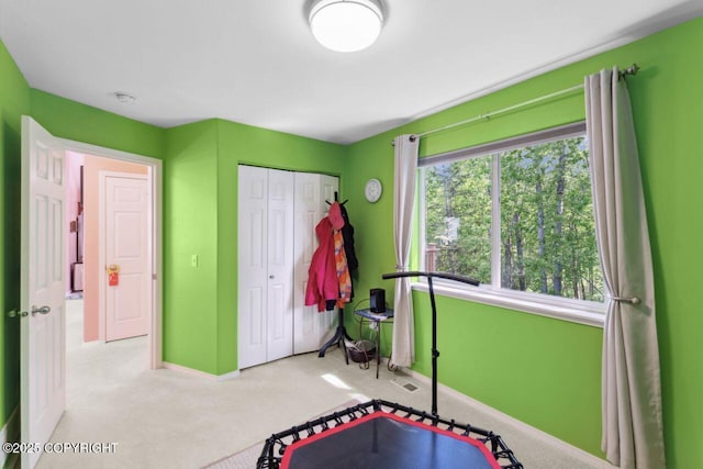 4245 Scenic View Dr, Anchorage, AK 99504 - workout room with baseboards and carpet floors
