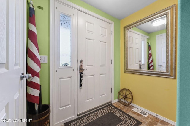 4245 Scenic View Dr, Anchorage, AK 99504 - foyer entrance with baseboards and stone finish flooring