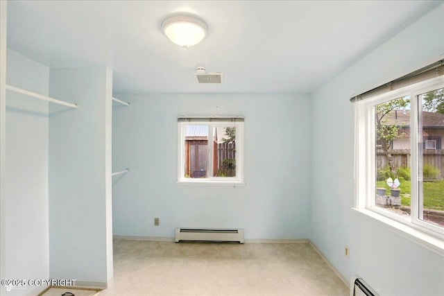 2527 Cottonwood St, Anchorage, AK 99508 - spare room with a baseboard heating unit, plenty of natural light, and baseboards