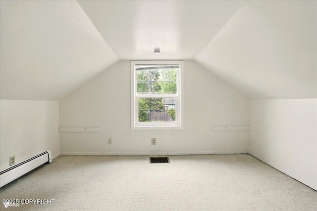 2527 Cottonwood St, Anchorage, AK 99508 - additional living space with a baseboard heating unit, carpet floors, and lofted ceiling