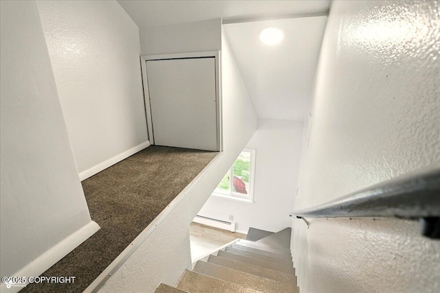 2527 Cottonwood St, Anchorage, AK 99508 - staircase featuring a baseboard radiator and baseboards