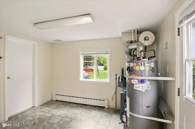 2527 Cottonwood St, Anchorage, AK 99508 - utilities with a baseboard heating unit and secured water heater