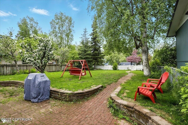 2527 Cottonwood St, Anchorage, AK 99508 - view of yard featuring a playground and a patio area