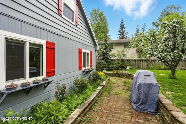 2527 Cottonwood St, Anchorage, AK 99508 - view of side of property featuring a patio area