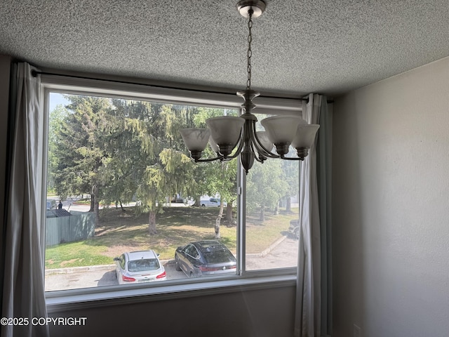 1008 Wildrose Ct, Anchorage, AK 99518 - detailed view of a chandelier and a textured ceiling
