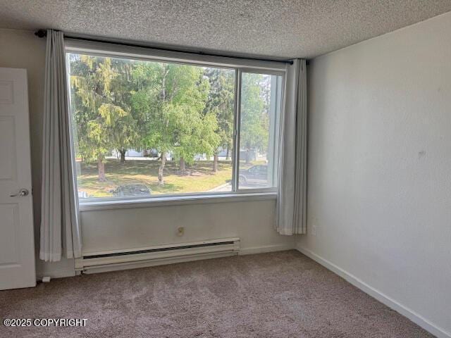 1008 Wildrose Ct, Anchorage, AK 99518 - carpeted spare room with a baseboard radiator and a textured ceiling