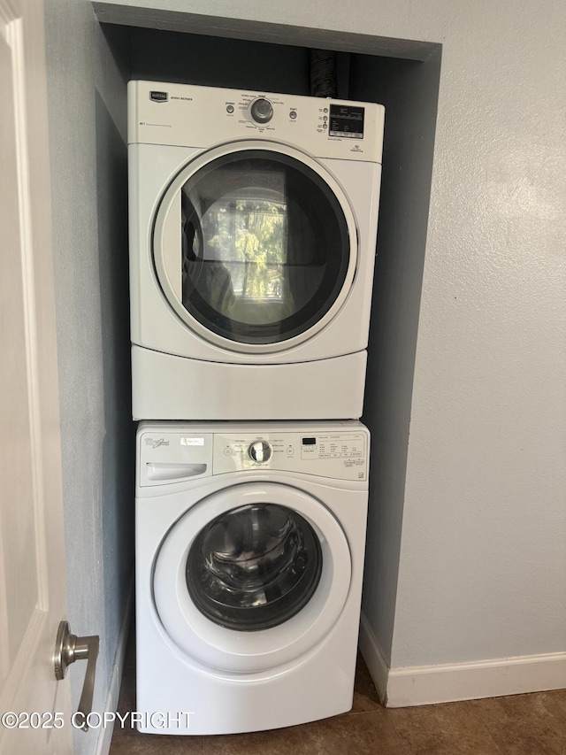 1008 Wildrose Ct, Anchorage, AK 99518 - laundry room with stacked washer / dryer and baseboards