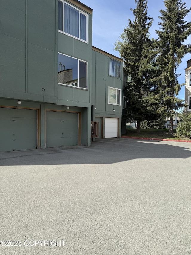 1008 Wildrose Ct, Anchorage, AK 99518 - view of property featuring an attached garage