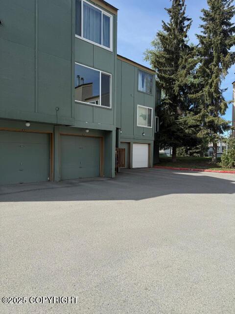 1008 Wildrose Ct, Anchorage, AK 99518 - view of property featuring an attached garage