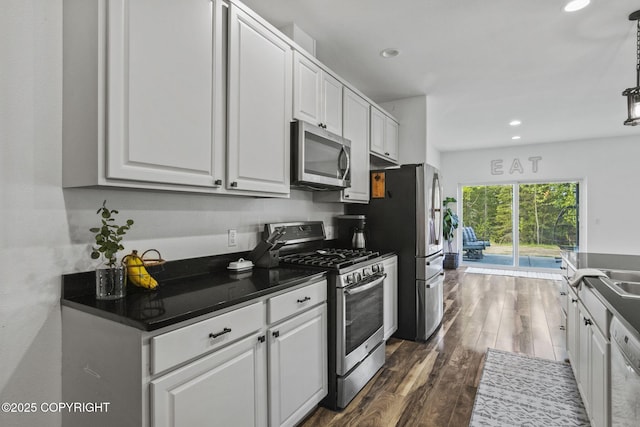 37653 Deville Rd, Soldotna, AK 99669 - kitchen featuring stainless steel appliances, dark wood-type flooring, white cabinetry, and recessed lighting