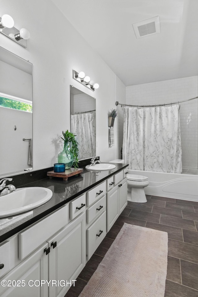 37653 Deville Rd, Soldotna, AK 99669 - bathroom featuring double vanity, shower / tub combo, toilet, and wood tiled floors