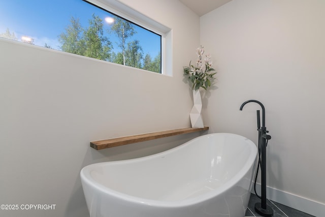 1645 N Vroman Dr, Palmer, AK 99645 - bathroom with a soaking tub and baseboards