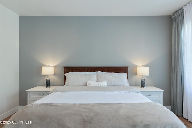 1645 N Vroman Dr, Palmer, AK 99645 - bedroom featuring baseboards and wood finished floors