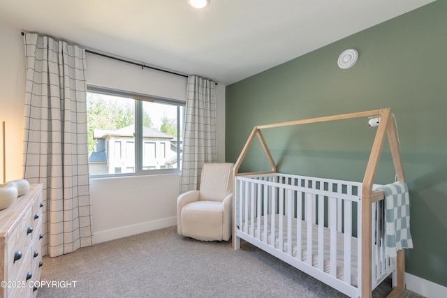 1645 N Vroman Dr, Palmer, AK 99645 - bedroom featuring carpet, baseboards, and a crib