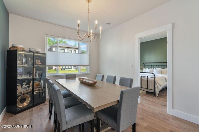 1645 N Vroman Dr, Palmer, AK 99645 - dining room with a chandelier, light wood-style floors, and baseboards