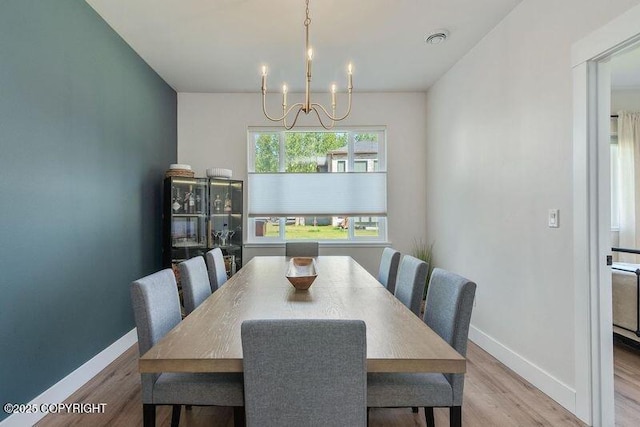 1645 N Vroman Dr, Palmer, AK 99645 - dining area with a chandelier, baseboards, and wood finished floors