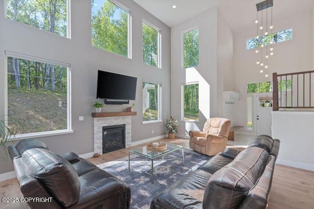 1645 N Vroman Dr, Palmer, AK 99645 - living area with a towering ceiling, baseboards, and wood finished floors