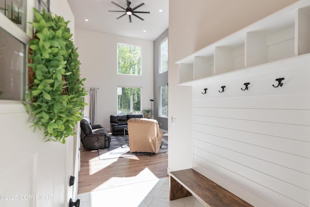 1645 N Vroman Dr, Palmer, AK 99645 - mudroom featuring a towering ceiling, recessed lighting, ceiling fan, and wood finished floors