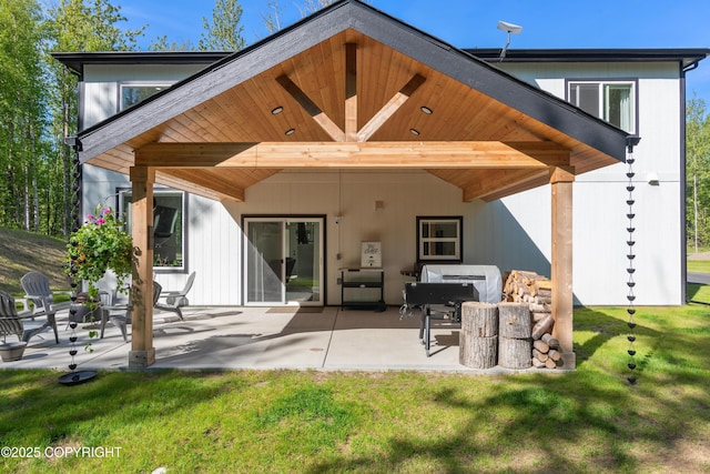 1645 N Vroman Dr, Palmer, AK 99645 - rear view of property featuring a patio and a yard