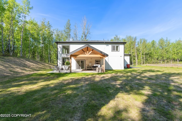 1645 N Vroman Dr, Palmer, AK 99645 - back of house with a patio area and a yard