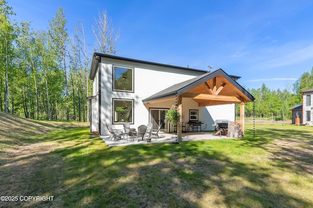 1645 N Vroman Dr, Palmer, AK 99645 - back of house featuring a patio and a yard