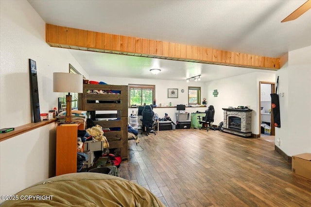 7965 S Settlers Bay Dr, Wasilla, AK 99623 - office space with wood finished floors, a fireplace, and a ceiling fan