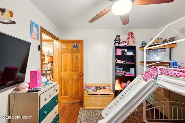7965 S Settlers Bay Dr, Wasilla, AK 99623 - bedroom with wood finished floors and a ceiling fan