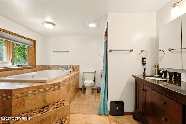 7965 S Settlers Bay Dr, Wasilla, AK 99623 - bathroom with a garden tub, vanity, toilet, tile patterned floors, and baseboards