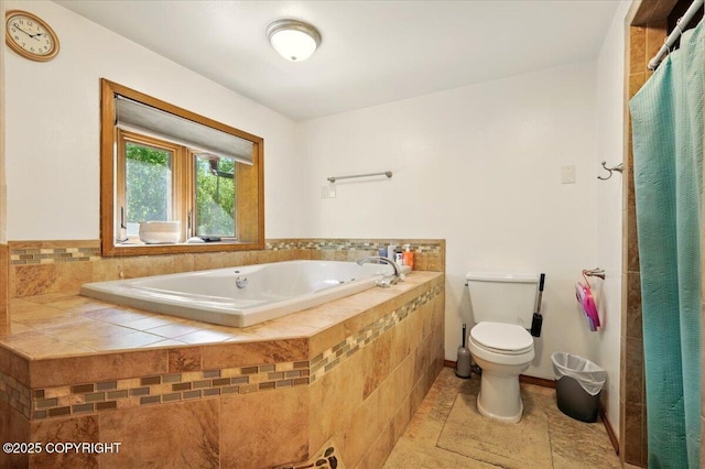 7965 S Settlers Bay Dr, Wasilla, AK 99623 - bathroom with toilet, a garden tub, and tile patterned flooring