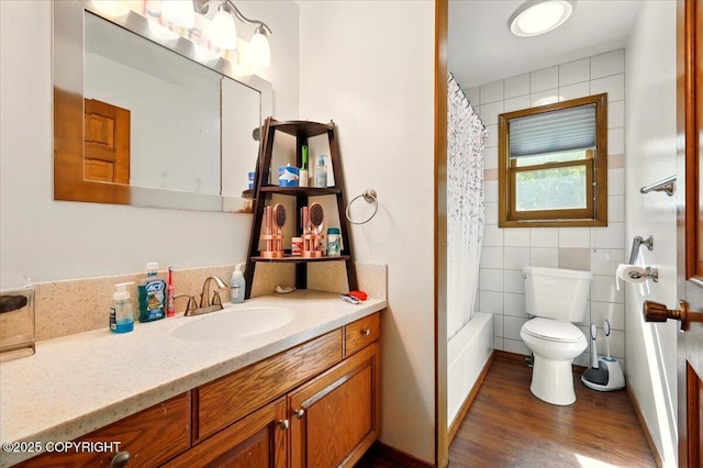 7965 S Settlers Bay Dr, Wasilla, AK 99623 - full bathroom with toilet, vanity, wood finished floors, shower / tub combo, and tile walls