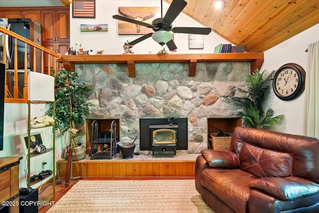 7965 S Settlers Bay Dr, Wasilla, AK 99623 - sitting room featuring vaulted ceiling, a ceiling fan, wood ceiling, wood finished floors, and a wood stove