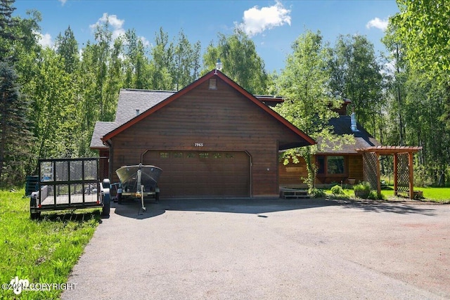 7965 S Settlers Bay Dr, Wasilla, AK 99623 - view of front of house with asphalt driveway and an attached garage