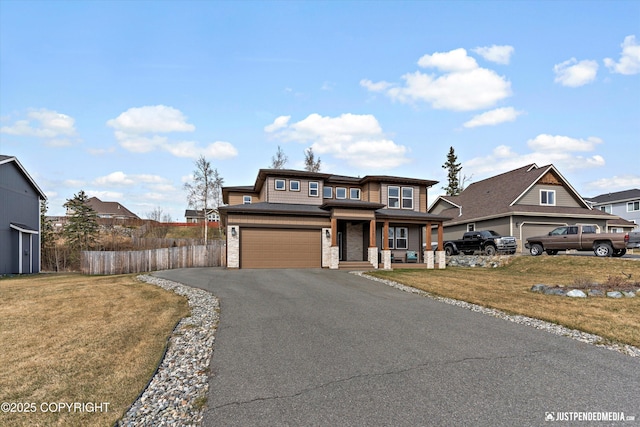 5167 E Henhouse Loop, Wasilla, AK 99654 - view of front of house featuring a porch, driveway, and an attached garage