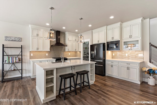 5167 E Henhouse Loop, Wasilla, AK 99654 - kitchen featuring black appliances, wall chimney exhaust hood, open shelves, a sink, and light countertops